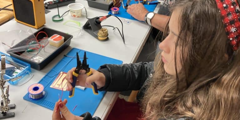 a student uses wire cutters